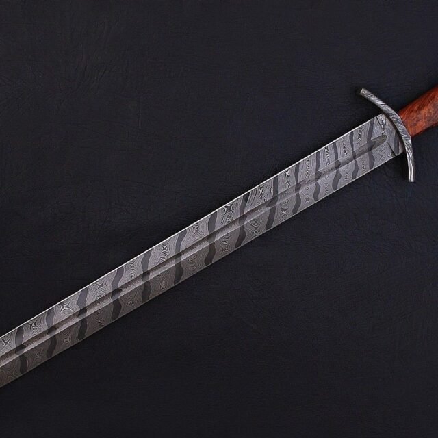 https://forgingblades.com/wp-content/uploads/2022/03/Handmade-Damascus-Steel-Sword-3-640x640.jpg